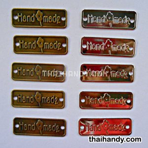 ป้ายโลหะ สี่เหลี่ยม ขนาด 1.5x4.5 cm  บรรจุ 100 อัน สีคละสีเงินกับทองรมดำ รูปเต็ม