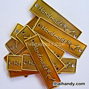 ป้ายโลหะ สี่เหลี่ยม ขนาด 2x7 cm  บรรจุ 10 อัน สีทองรมดำ รูปเต็ม