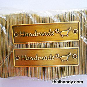 ป้ายโลหะ สี่เหลี่ยม ขนาด 2x7 cm  บรรจุ 100 อัน สีทองรมดำ รูปเต็ม