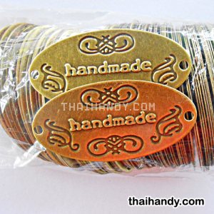 ป้ายโลหะ วงรี ขนาด 3x6 cm  บรรจุ 100 อัน สีทองรมดำ รูปเต็ม