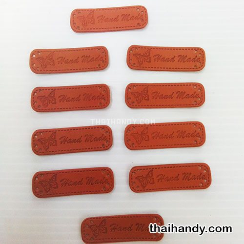 ป้ายหนัง หนัง ขนาด 1.5x5 cm  บรรจุ 10 อัน สีน้ำตาล รูปเต็ม