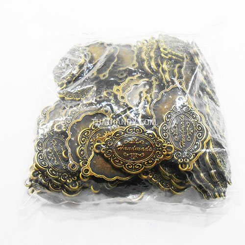 ป้ายโลหะ ลายไทย ขนาด 4x2.5 cm  บรรจุ 100 อัน สีทองรมดำ รูปเต็ม