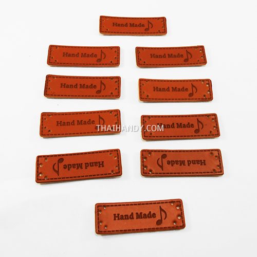 ป้ายหนัง หนัง ขนาด 1.5x5 cm  บรรจุ 10 อัน สีน้ำตาล รูปเต็ม