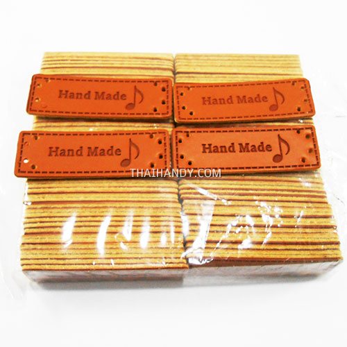 ป้ายหนัง หนัง ขนาด 1.5x5 cm  บรรจุ 100 อัน สีน้ำตาล รูปเต็ม