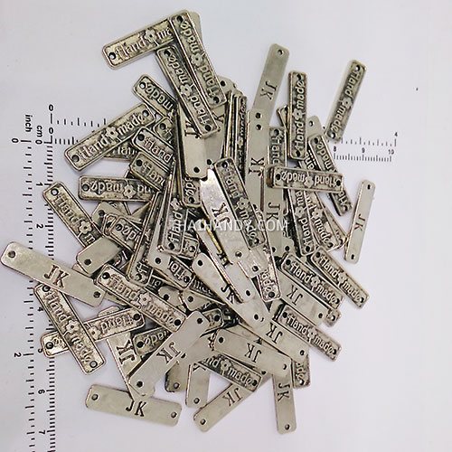 ป้ายโลหะ สี่เหลี่ยม ขนาด 2.5x0.5 cm  บรรจุ 100 อัน สีนิเกิ้ล รูปเต็ม